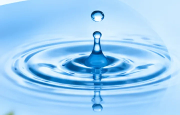 Water droplet creating ripples